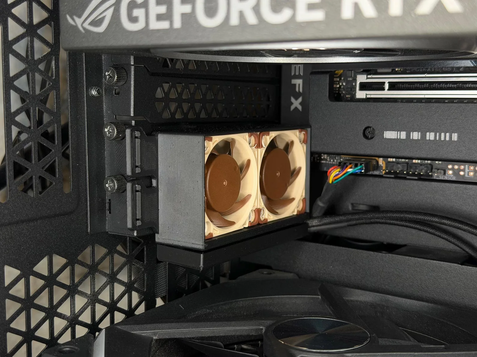 My mount holding two 40 mm fans in a PCIe slot below a graphics card